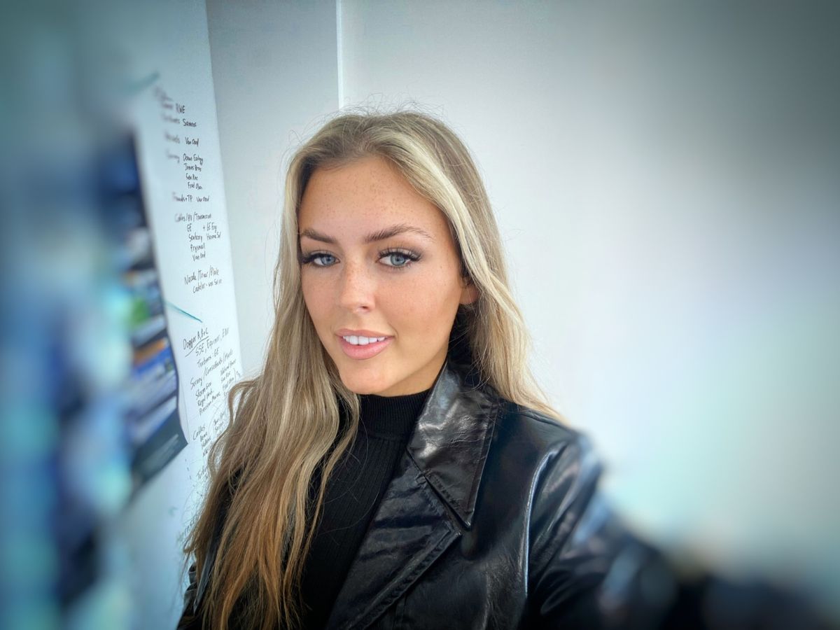 Woman in a black leather jacket.