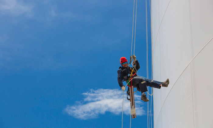 man doing rope access work on a wind turbine